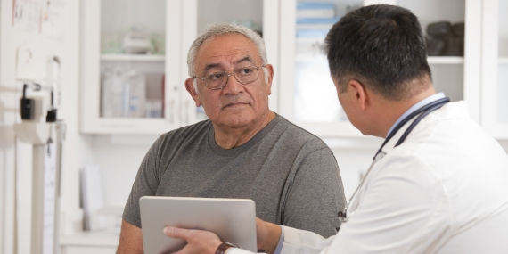 Male patient talking to doctor about surgery