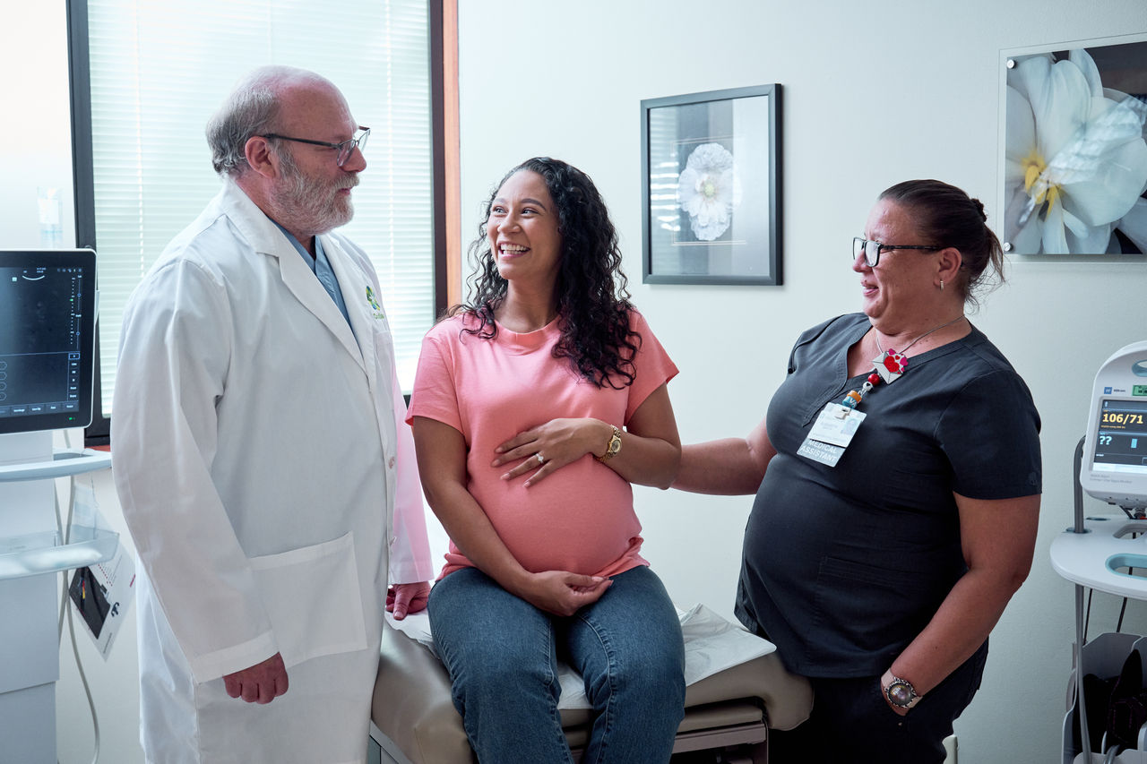 Dr Fink and pregnant patient and medical assistant Dr Fink and pregnant patient and medical assistant