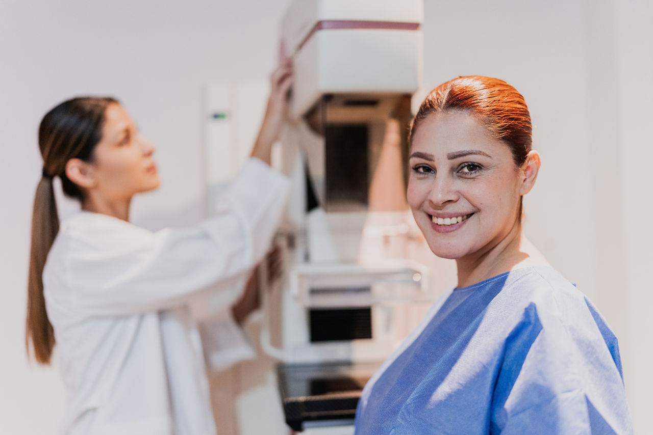 Portrait of a mid adult woman in mammography room at hospital Portrait of a mid adult woman in mammography room at hospital
